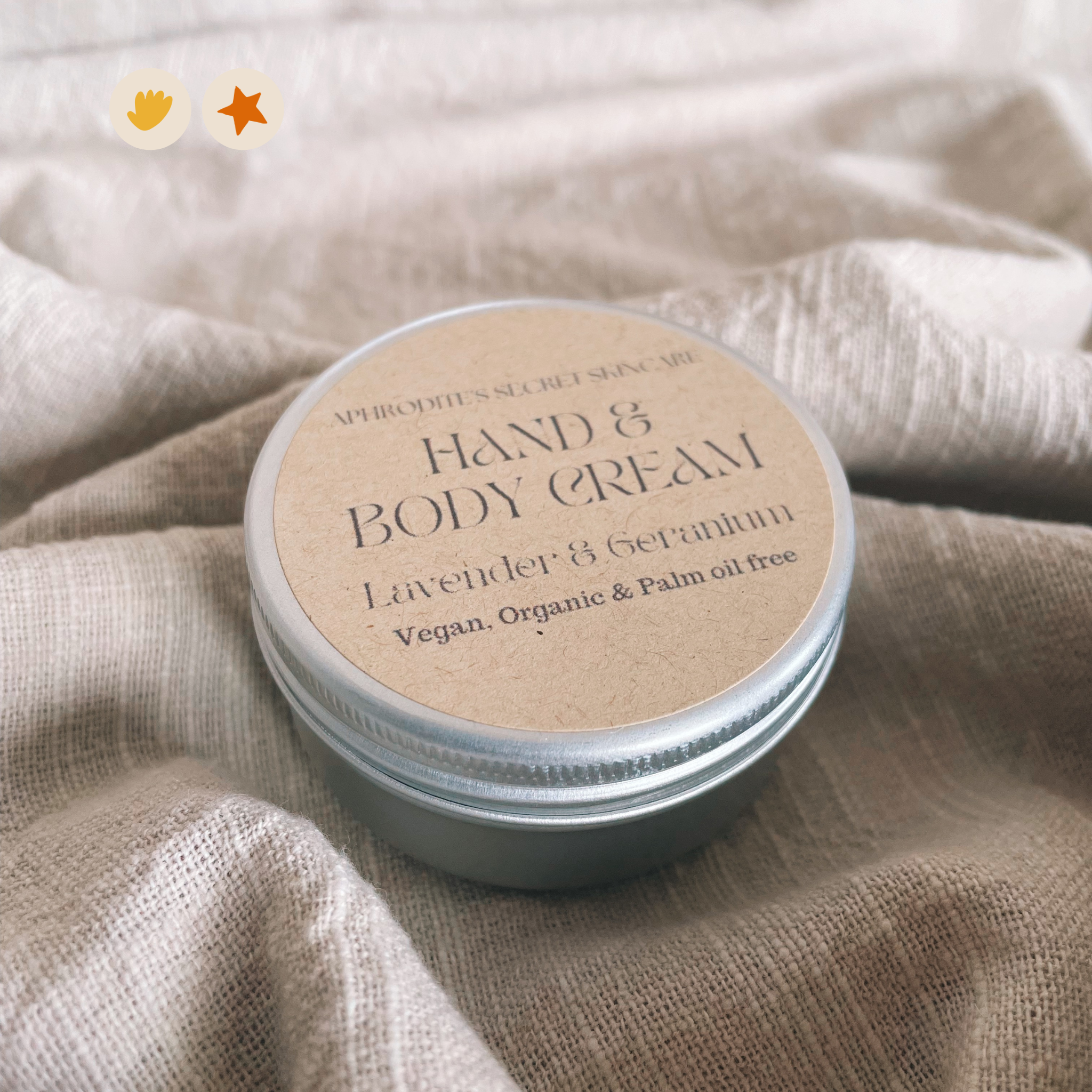 Metal jar of hand and body cream on a linen backdrop