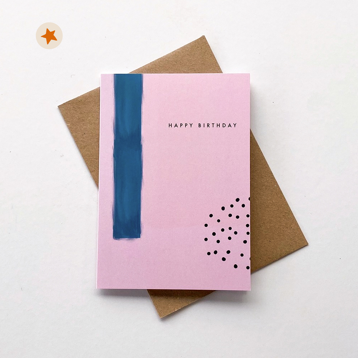 Pink card with a navy paint stripe, navy dots and the words &quot;Happy Birthday&quot; in navy text.
