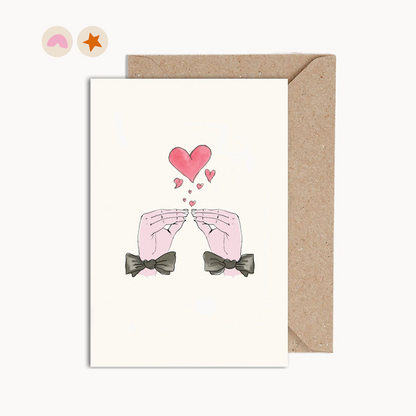 Card with an illustration of two hand kissing with hearts, both hands are wearing bow ties.